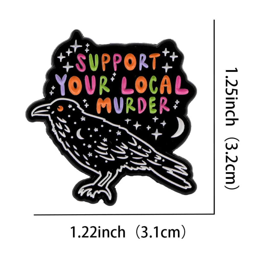 Add a touch of whimsy with Kiss Me Later’s colorful enamel pin: a black crow with stars and Support Your Local Murder in multicolored letters. Measures 1.25 tall by 1.22 wide—a striking piece for any cat pin or coffin badge collection!.