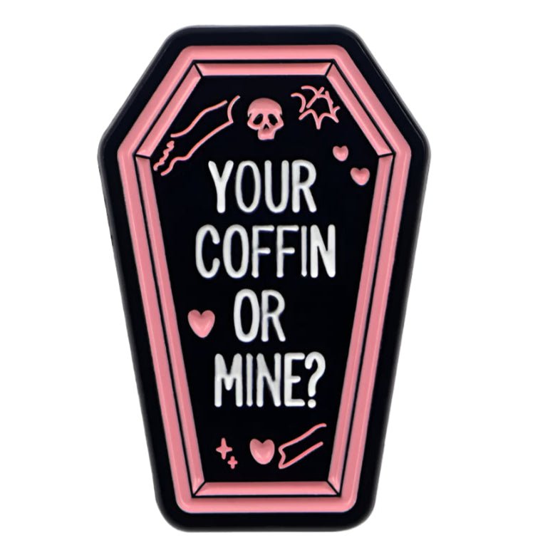 This Kiss Me Later badge features a black coffin with a pink outline, YOUR COFFIN OR MINE? text, and icons like a skull, bat, hearts, and sparkles—an ideal accessory for any true crime fan.